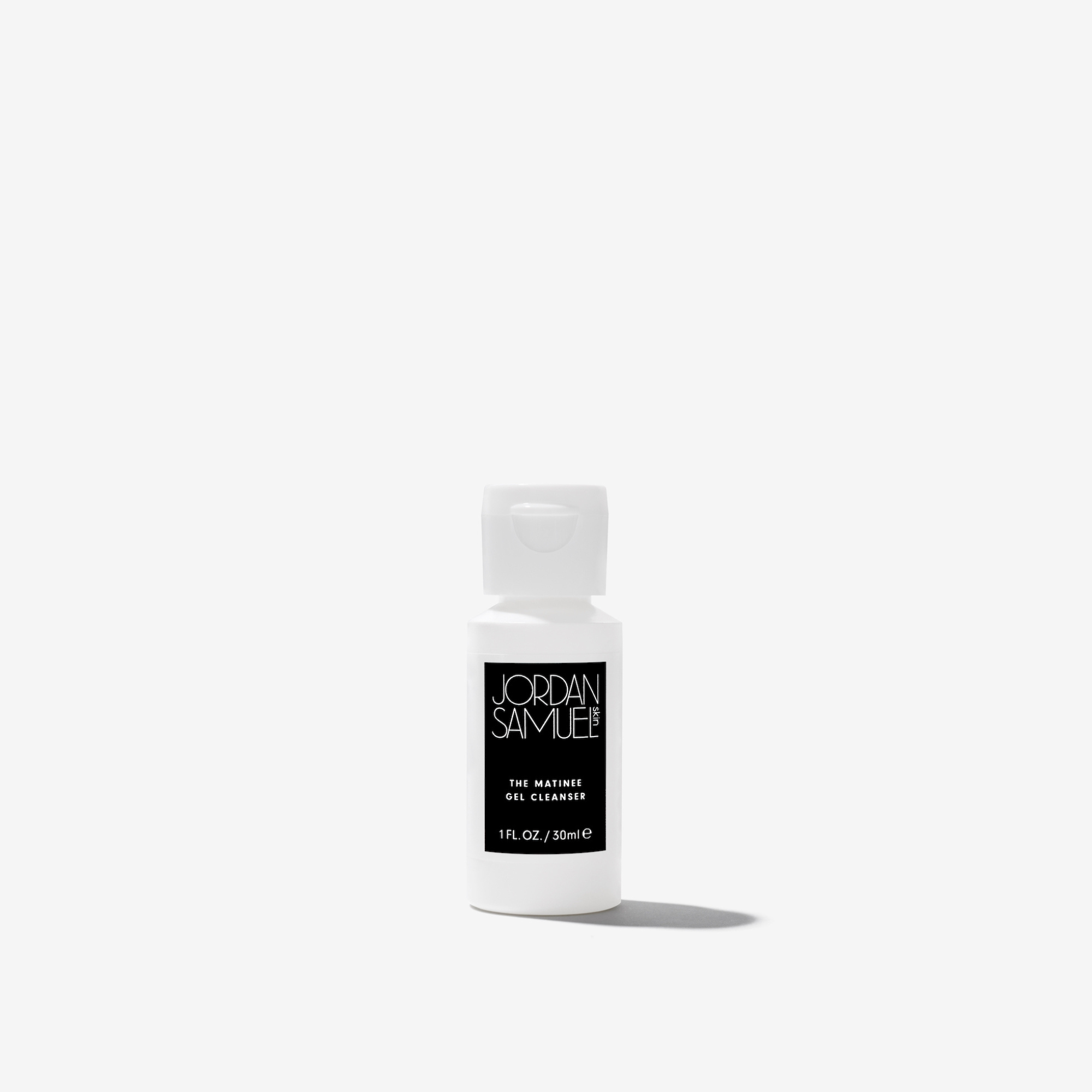 The Matinee Gel Cleanser mini product image - White squeeze bottle with black label on white background