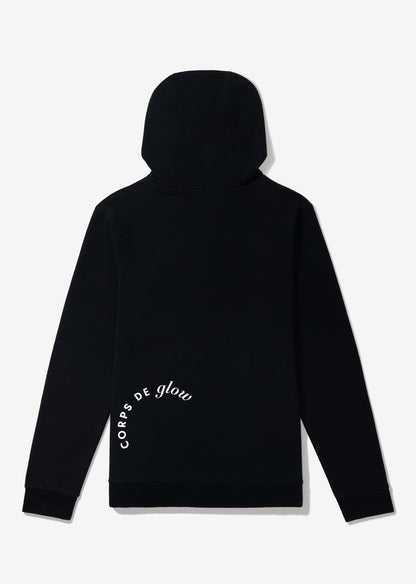 Back of black hoodie with Corps de Glow logo in white type on lower left back.